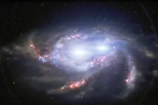 Illustration av två galaxer som smälter samman.